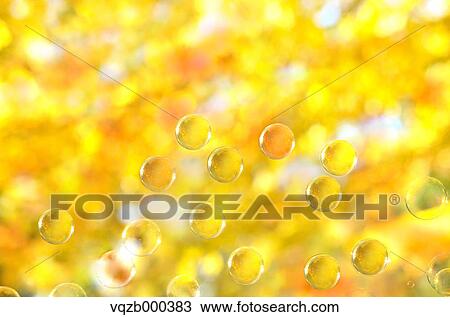 Stock Image - Soap bubbles and autumn leaves. Fotosearch