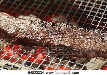 Steak on grill View Large Photo Image Picture - Steak on grill. Fotosearch