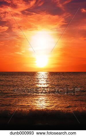 Sunset on the beach View Large Photo Image Stock Image - Sunset on the beach. Fotosearch