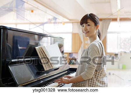 Teacher at Japanese kindergarten View Large Photo Image Stock Photo - Teacher at Japanese kindergarten. Fotosearch