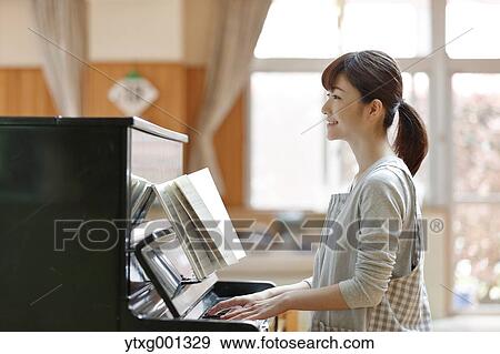 Stock Photo - Teacher at Japanese kindergarten. Fotosearch