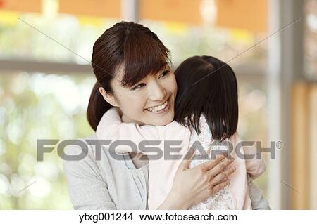 Picture - Teacher with kid at Japanese kindergarten. Fotosearch