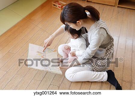 Teacher with kid at Japanese kindergarten View Large Photo Image Picture - Teacher with kid at Japanese kindergarten. Fotosearch