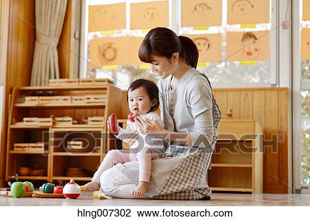Teacher with kid at Japanese kindergarten View Large Photo Image Stock Image - Teacher with kid at Japanese kindergarten. Fotosearch