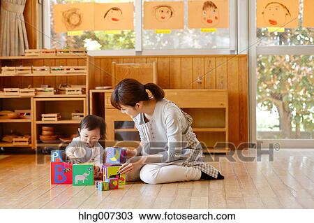 Teacher with kid at Japanese kindergarten View Large Photo Image Stock Image - Teacher with kid at Japanese kindergarten. Fotosearch