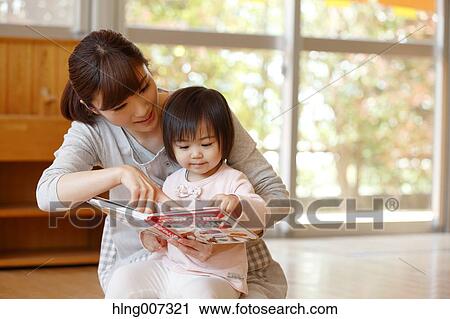 Teacher with kid at Japanese kindergarten View Large Photo Image Stock Image - Teacher with kid at Japanese kindergarten. Fotosearch