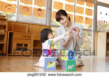 Teacher with kid at Japanese kindergarten View Large Photo Image Stock Image - Teacher with kid at Japanese kindergarten. Fotosearch