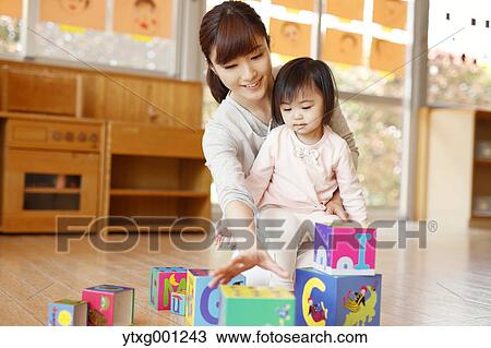 Teacher with kid at Japanese kindergarten View Large Photo Image Stock Image - Teacher with kid at Japanese kindergarten. Fotosearch