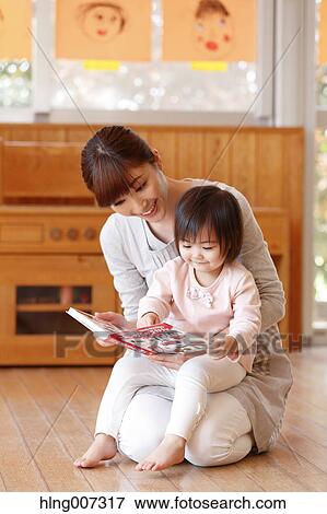 Teacher with kid at Japanese kindergarten View Large Photo Image Stock Photo - Teacher with kid at Japanese kindergarten. Fotosearch