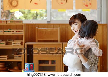 Teacher with kid at Japanese kindergarten View Large Photo Image Stock Photo - Teacher with kid at Japanese kindergarten. Fotosearch
