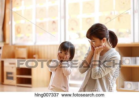Teacher with kid at Japanese kindergarten View Large Photo Image Stock Photo - Teacher with kid at Japanese kindergarten. Fotosearch