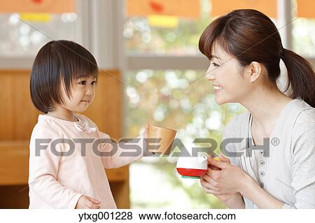 Teacher with kid at Japanese kindergarten View Large Photo Image Stock Photo - Teacher with kid at Japanese kindergarten. Fotosearch