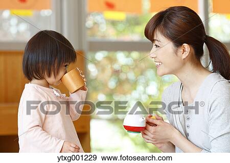 Teacher with kid at Japanese kindergarten View Large Photo Image Stock Photo - Teacher with kid at Japanese kindergarten. Fotosearch