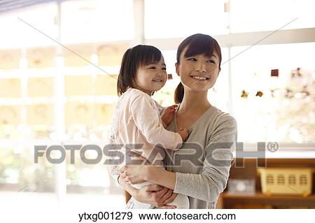Stock Photo - Teacher with kid at Japanese kindergarten. Fotosearch