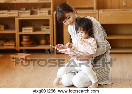 Teacher with kid at Japanese kindergarten View Large Photo Image Stock Photograph - Teacher with kid at Japanese kindergarten. Fotosearch