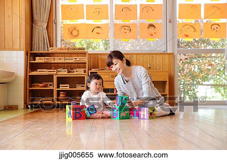 Teacher with kid at Japanese kindergarten View Large Photo Image Stock Photography - Teacher with kid at Japanese kindergarten. Fotosearch