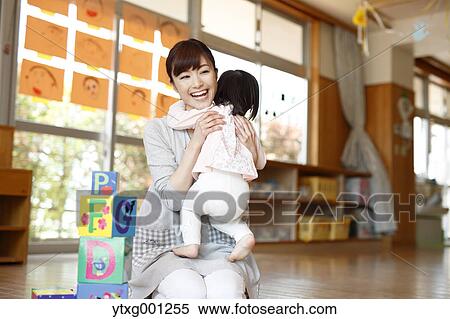 Teacher with kid at Japanese kindergarten View Large Photo Image Stock Photography - Teacher with kid at Japanese kindergarten. Fotosearch