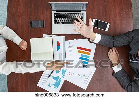 Top view of Japanese businesspeople talking in meeting room View Large Photo Image Stock Image - Top view of Japanese businesspeople talking in meeting room. Fotosearch