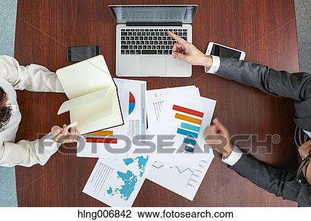 Top view of Japanese businesspeople talking in meeting room View Large Photo Image Stock Image - Top view of Japanese businesspeople talking in meeting room. Fotosearch