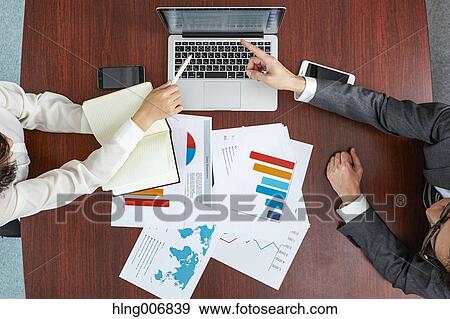 Top view of Japanese businesspeople talking in meeting room View Large Photo Image Stock Photo - Top view of Japanese businesspeople talking in meeting room. Fotosearch
