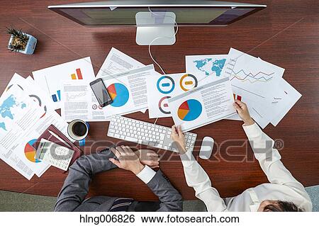 Top view of Japanese businesspeople talking in meeting room View Large Photo Image Stock Photograph - Top view of Japanese businesspeople talking in meeting room. Fotosearch