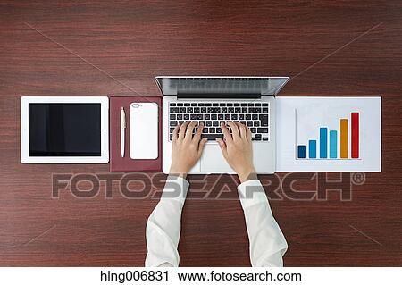 Stock Image - Top view of Japanese businesswoman in the office. Fotosearch