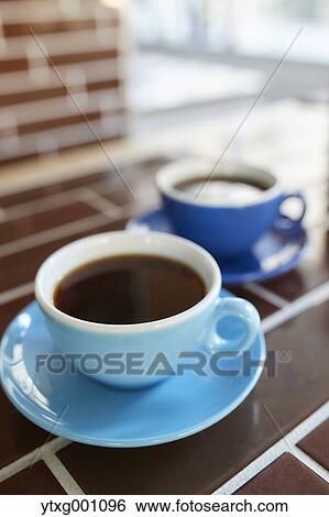 Two cups of coffee View Large Photo Image Stock Photograph - Two cups of coffee. Fotosearch