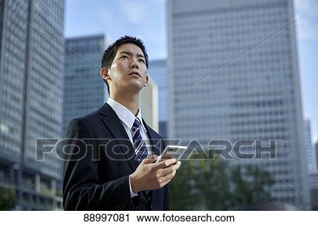 Young Japanese businessman View Large Photo Image Stock Image - Young Japanese businessman. Fotosearch