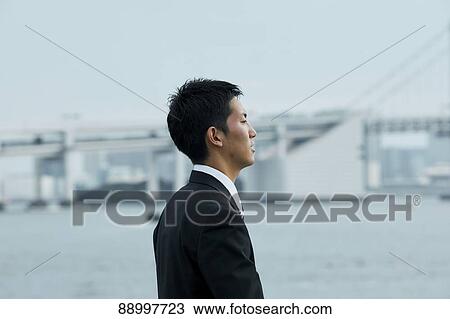 Young Japanese businessman View Large Photo Image Stock Image - Young Japanese businessman. Fotosearch
