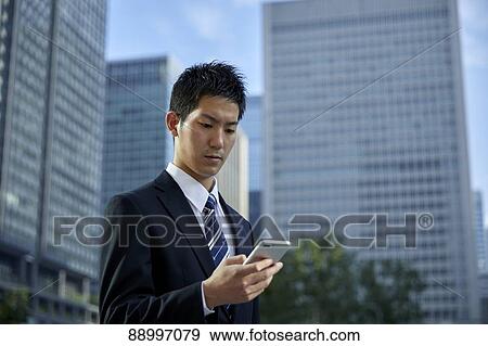 Young Japanese businessman View Large Photo Image Stock Photo - Young Japanese businessman. Fotosearch