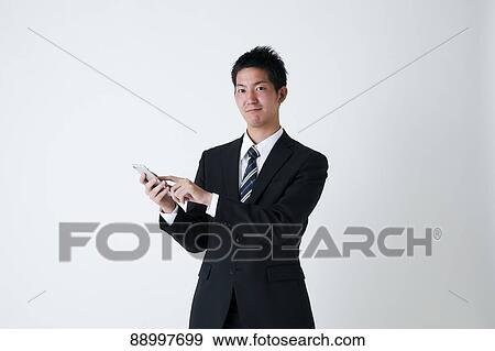Stock Photo - Young Japanese businessman. Fotosearch