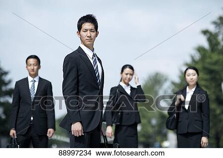Picture - Young Japanese businesspeople. Fotosearch