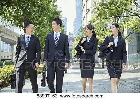 Stock Image - Young Japanese businesspeople. Fotosearch