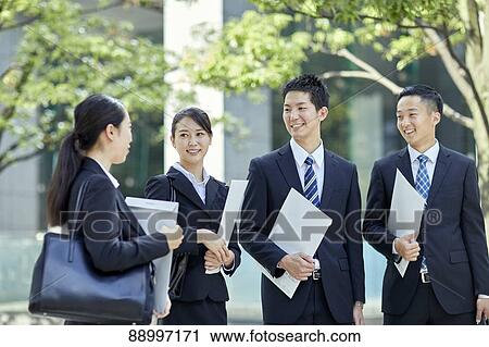 Stock Image - Young Japanese businesspeople. Fotosearch