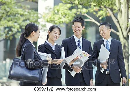 Stock Image - Young Japanese businesspeople. Fotosearch