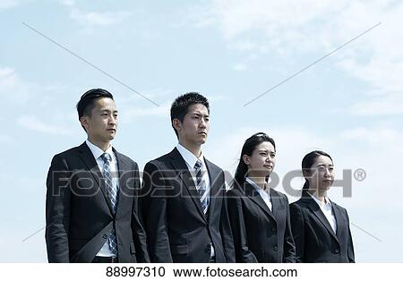 Stock Image - Young Japanese businesspeople. Fotosearch