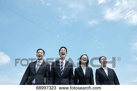 Stock Image - Young Japanese businesspeople. Fotosearch