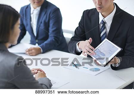 Stock Image - Young Japanese businesspeople. Fotosearch