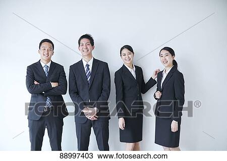 Stock Image - Young Japanese businesspeople. Fotosearch