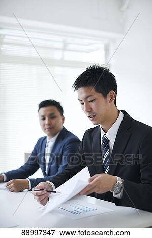 Stock Photo - Young Japanese businesspeople. Fotosearch