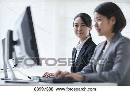 Stock Photo - Young Japanese businesspeople. Fotosearch
