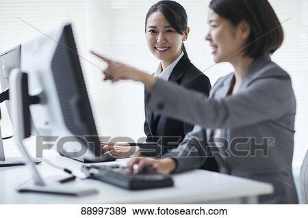 Stock Photo - Young Japanese businesspeople. Fotosearch