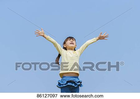 Young Japanese girl and blue sky View Large Photo Image Stock Photo - Young Japanese girl and blue sky. Fotosearch