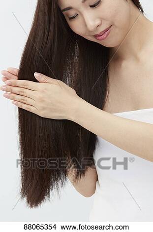 Young Japanese model with beautiful hair View Large Photo Image Picture - Young Japanese model with beautiful hair. Fotosearch