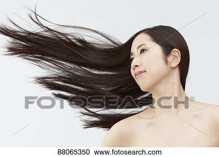 Stock Image - Young Japanese model with beautiful hair. Fotosearch
