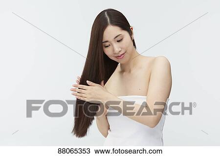 Young Japanese model with beautiful hair View Large Photo Image Stock Image - Young Japanese model with beautiful hair. Fotosearch