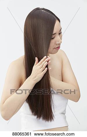 Young Japanese model with beautiful hair View Large Photo Image Stock Image - Young Japanese model with beautiful hair. Fotosearch