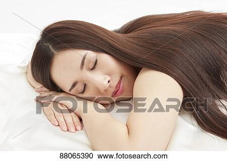 Stock Image - Young Japanese model with beautiful hair. Fotosearch