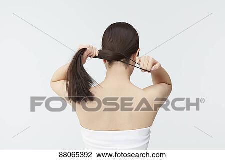 Stock Image - Young Japanese model with beautiful hair. Fotosearch