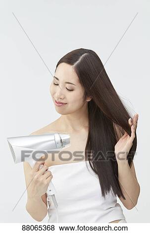Young Japanese model with beautiful hair View Large Photo Image Stock Photo - Young Japanese model with beautiful hair. Fotosearch